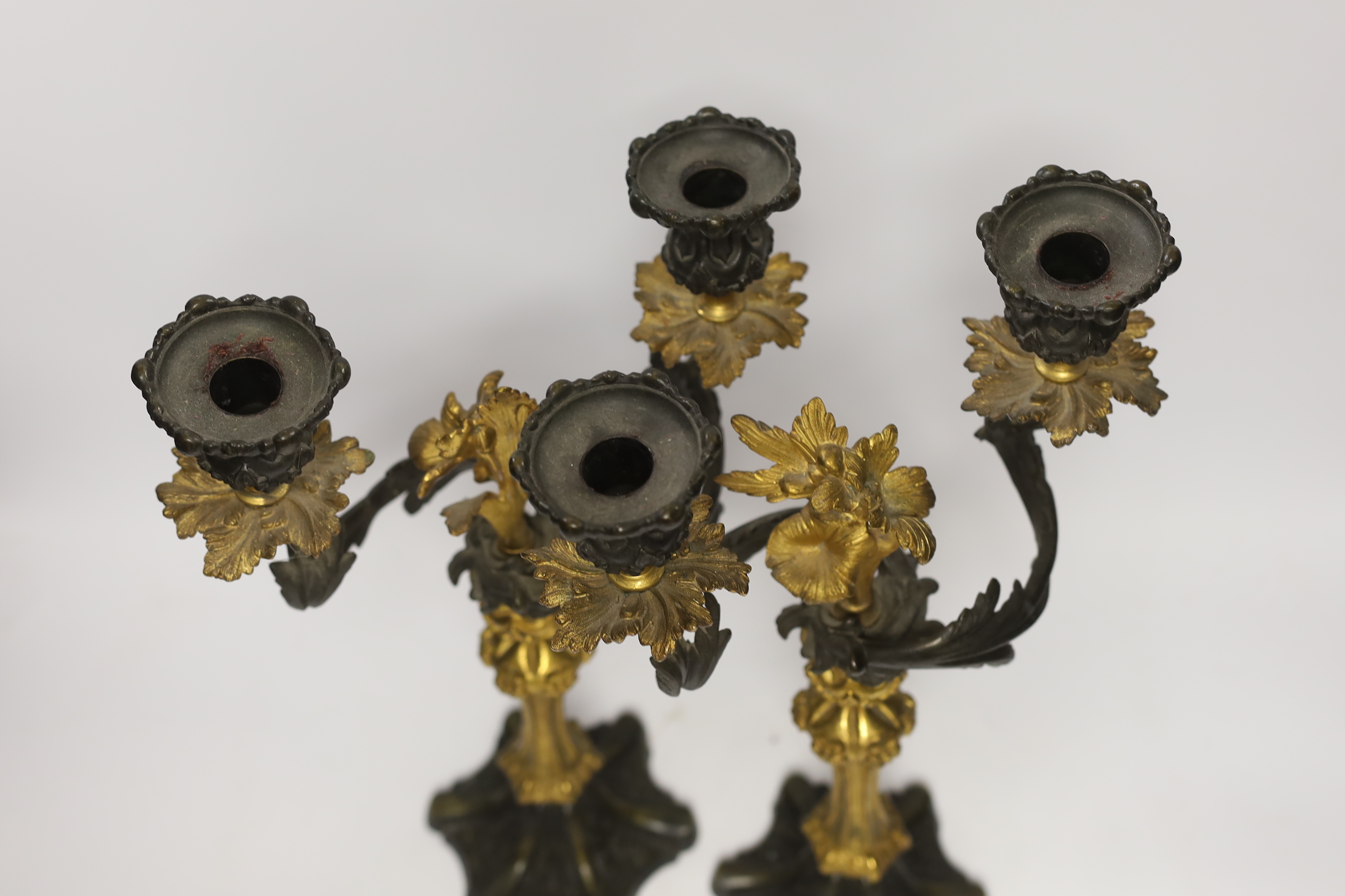 A pair of Victorian bronze and ormolu two branch candelabra, 39cm